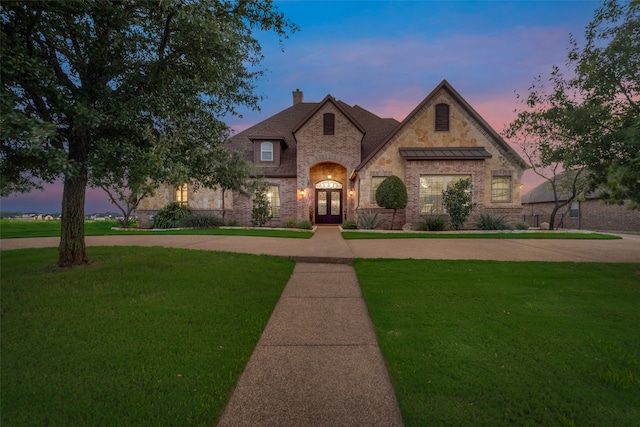 view of front of house with a yard