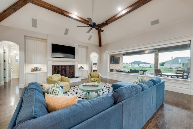 living room featuring ceiling fan, high vaulted ceiling, beamed ceiling, and dark hardwood / wood-style flooring