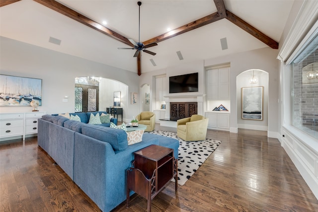 living room with ceiling fan, lofted ceiling with beams, and dark hardwood / wood-style flooring