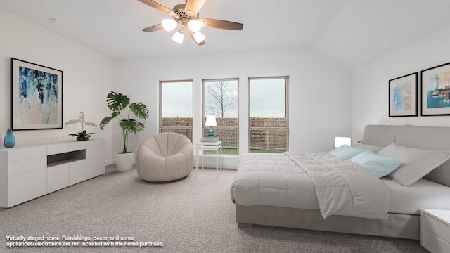 bedroom with carpet floors, ceiling fan, and lofted ceiling