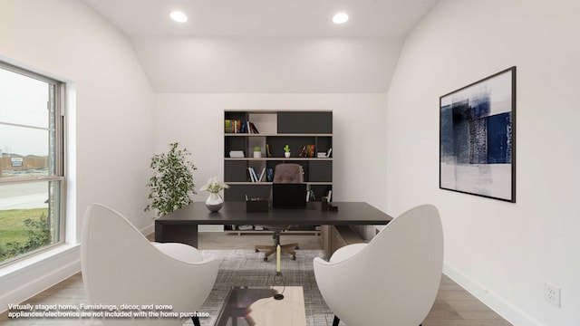 office area featuring hardwood / wood-style floors and lofted ceiling