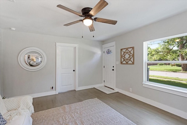 bedroom featuring wood-type flooring and ceiling fan