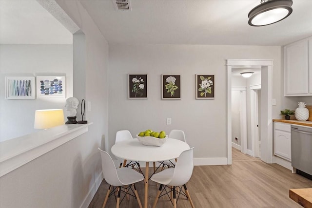 dining room featuring light hardwood / wood-style floors