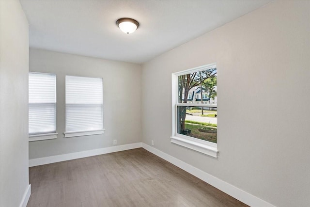 spare room featuring hardwood / wood-style floors