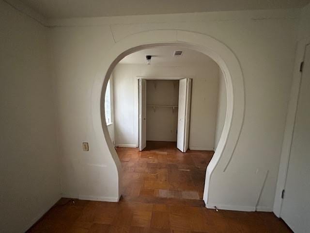 corridor with dark parquet floors