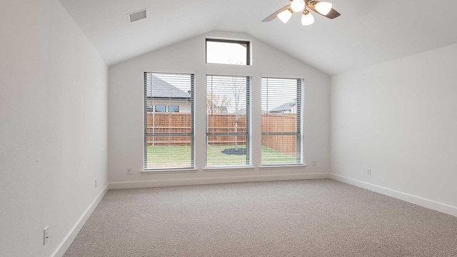 additional living space featuring ceiling fan, plenty of natural light, carpet, and lofted ceiling