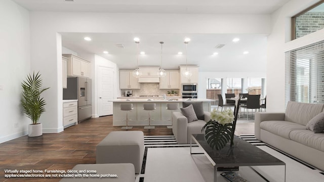 living room with dark hardwood / wood-style floors