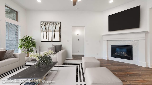 living room featuring dark hardwood / wood-style flooring and ceiling fan