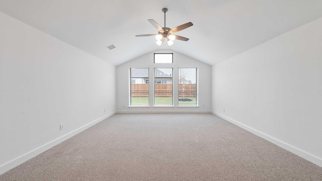 bonus room with ceiling fan, light colored carpet, and vaulted ceiling