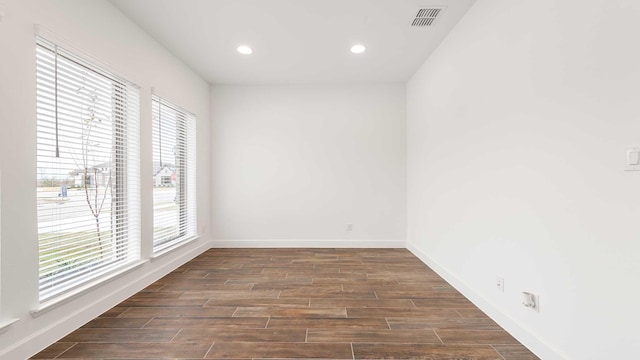 empty room featuring dark hardwood / wood-style flooring