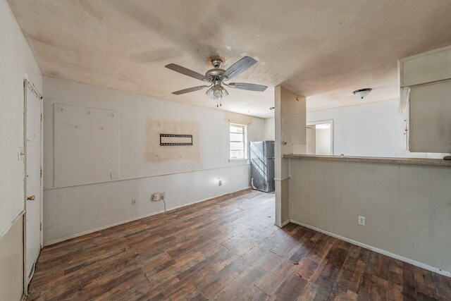 unfurnished room with ceiling fan and dark hardwood / wood-style floors