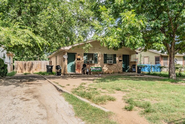 view of front of house featuring cooling unit