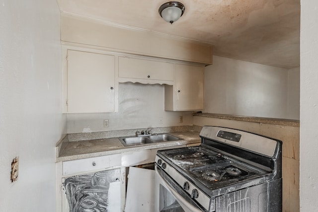 kitchen featuring sink and stainless steel gas range oven