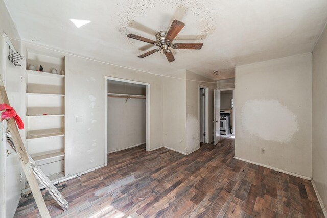 unfurnished bedroom with a closet, ceiling fan, and dark hardwood / wood-style floors