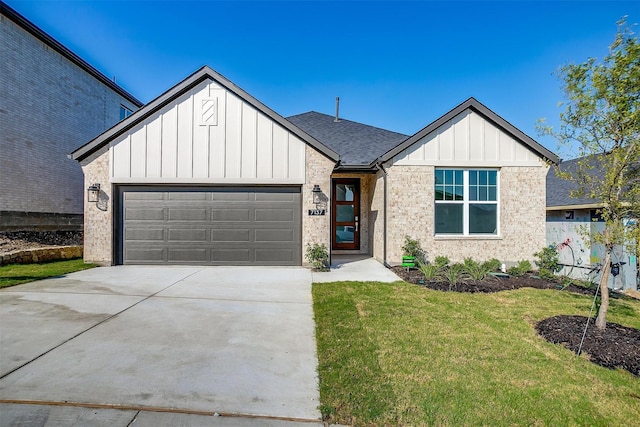 view of front of house with a garage and a front yard