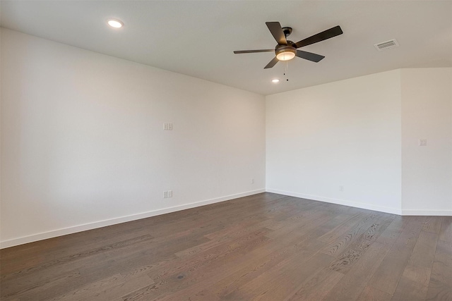 unfurnished room with dark hardwood / wood-style flooring and ceiling fan