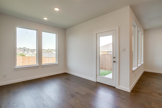 doorway with dark hardwood / wood-style floors