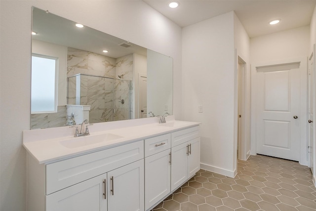 bathroom featuring vanity and a shower with door