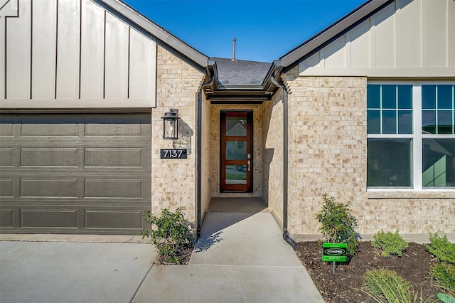 view of exterior entry featuring a garage