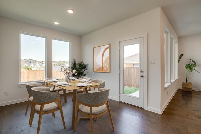 dining space featuring dark hardwood / wood-style floors