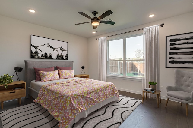 bedroom featuring dark hardwood / wood-style flooring and ceiling fan