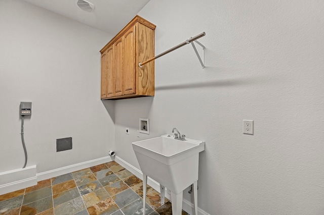 washroom featuring electric dryer hookup, sink, cabinets, and washer hookup