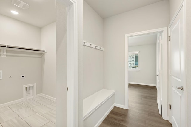 laundry room with electric dryer hookup, hookup for a gas dryer, washer hookup, and hardwood / wood-style flooring