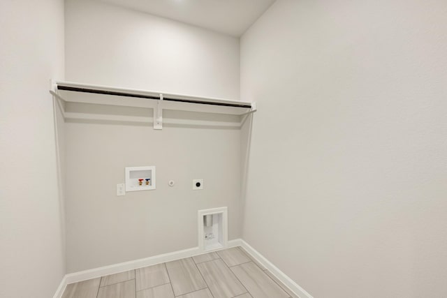 laundry area with gas dryer hookup, washer hookup, and hookup for an electric dryer