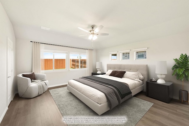 bedroom with ceiling fan and wood-type flooring