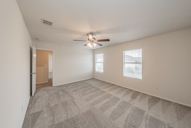 empty room with light carpet and ceiling fan