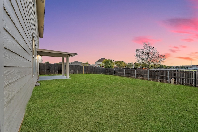 view of yard at dusk