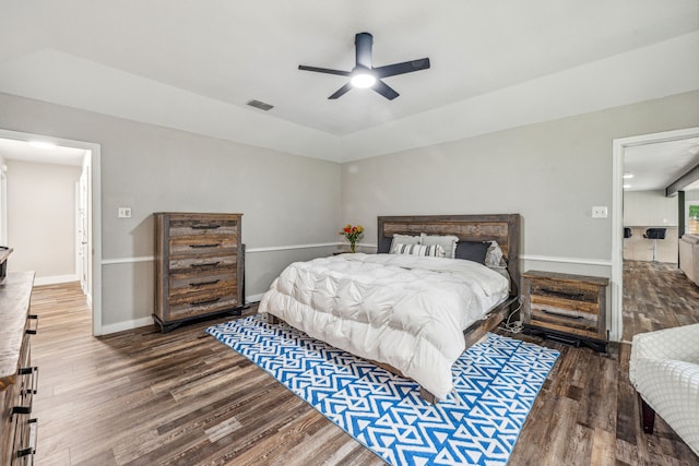 bedroom with ceiling fan and wood-type flooring