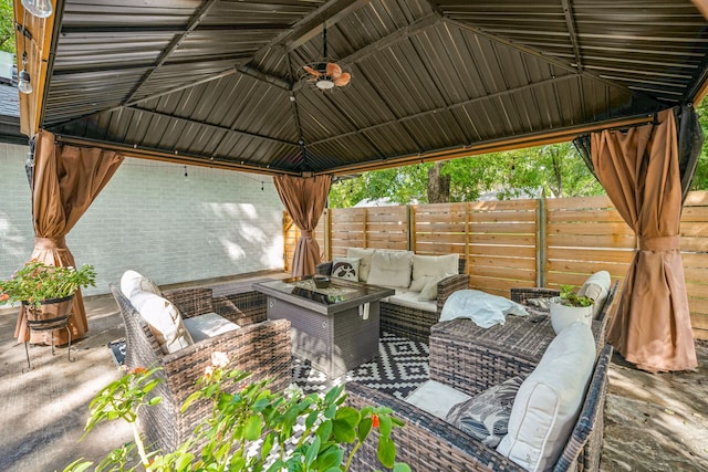 view of patio with a gazebo, an outdoor living space, and ceiling fan