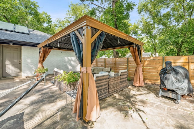 view of patio / terrace featuring a gazebo, grilling area, and an outdoor hangout area