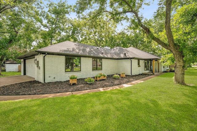 view of home's exterior with a garage and a yard