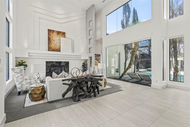 tiled living room with a high ceiling