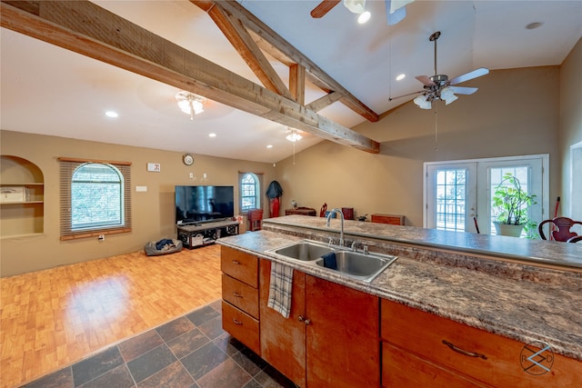 kitchen with french doors, dark wood-type flooring, ceiling fan, beamed ceiling, and sink