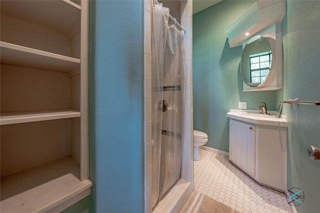 bathroom featuring vanity, tile patterned flooring, a shower with shower curtain, and toilet