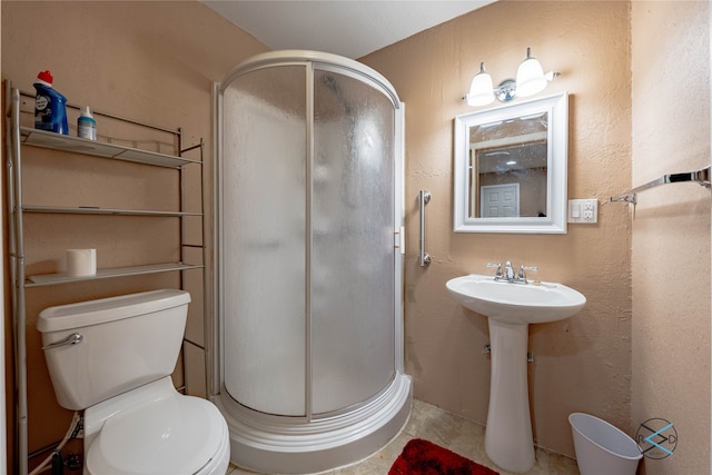 bathroom with walk in shower, tile patterned floors, and toilet