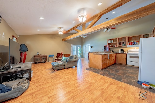 living room featuring sink, lofted ceiling with beams, ceiling fan, and dark wood-type flooring