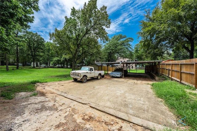 exterior space with a carport