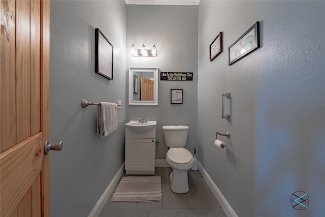 bathroom featuring vanity, tile patterned floors, and toilet