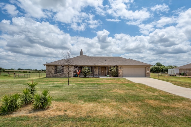 ranch-style home with a garage and a front lawn