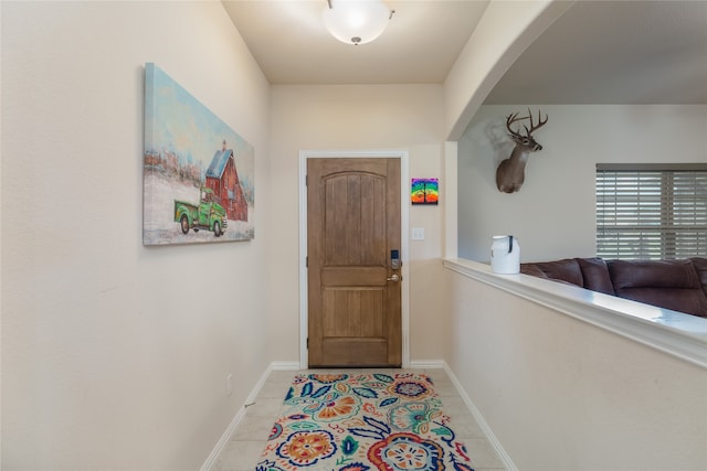 entryway featuring light tile patterned floors