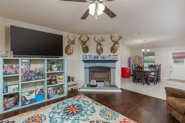 living room with hardwood / wood-style flooring and ceiling fan