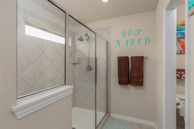 bathroom with a shower with shower door