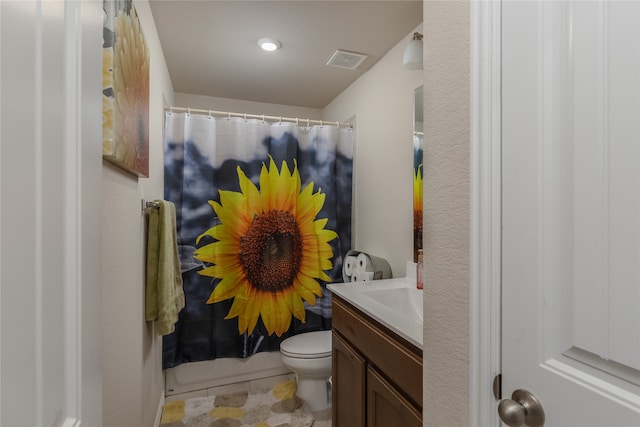 bathroom with vanity, toilet, and a shower with shower curtain