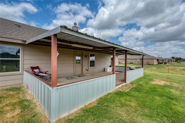 view of side of property featuring a yard