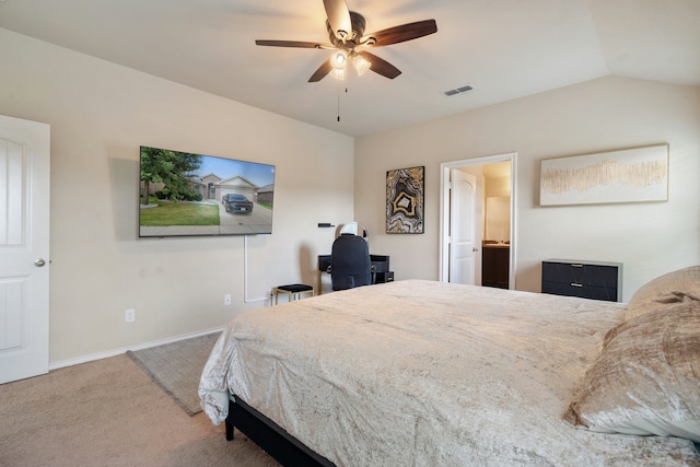 carpeted bedroom with ceiling fan, connected bathroom, and lofted ceiling