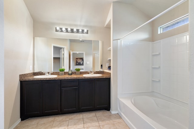 bathroom with tile patterned floors, shower / washtub combination, and vanity